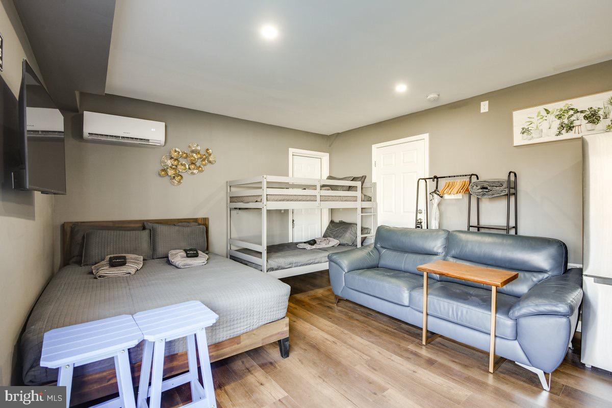 6604 Oak Street Cheverly, MD 20785 - Photo 10 of 16 a living room with furniture a flat screen tv and kitchen view