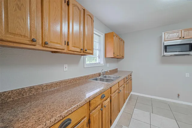 a kitchen with stainless steel appliances granite countertop a sink and dishwasher