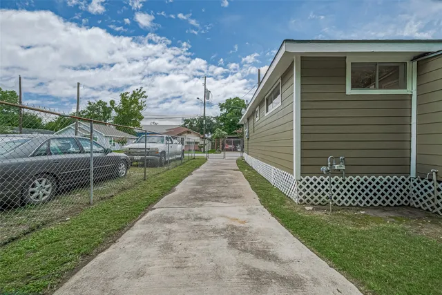 a view of a backyard with sitting area