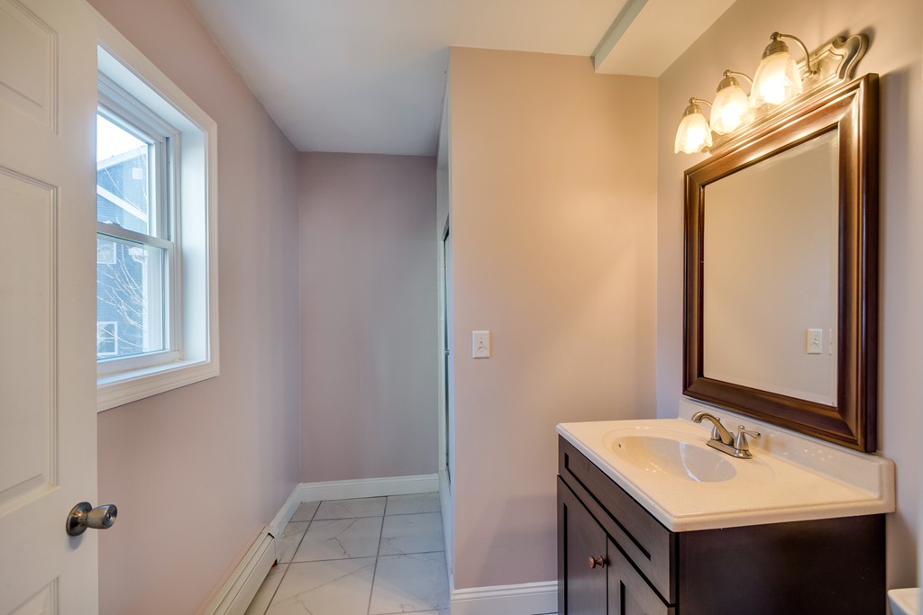 10 Felch Road Natick, MA 01760 - Photo 17 of 27 a bathroom with a sink vanity and a mirror