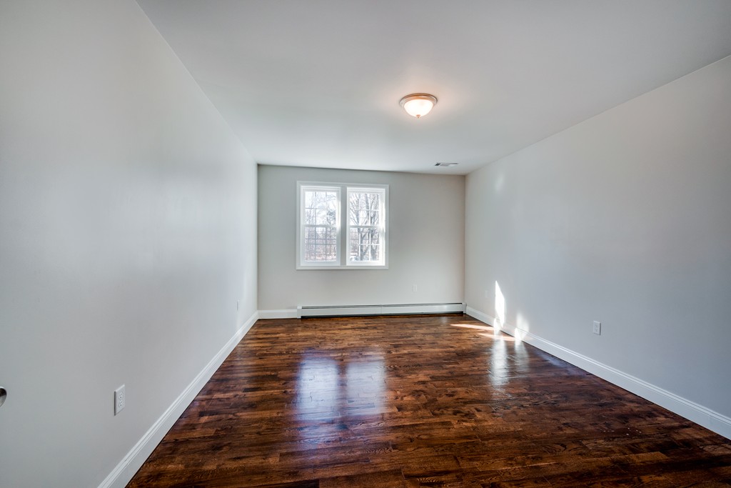 10 Felch Road Natick, MA 01760 - Photo 21 of 27 a view of empty room with wooden floor