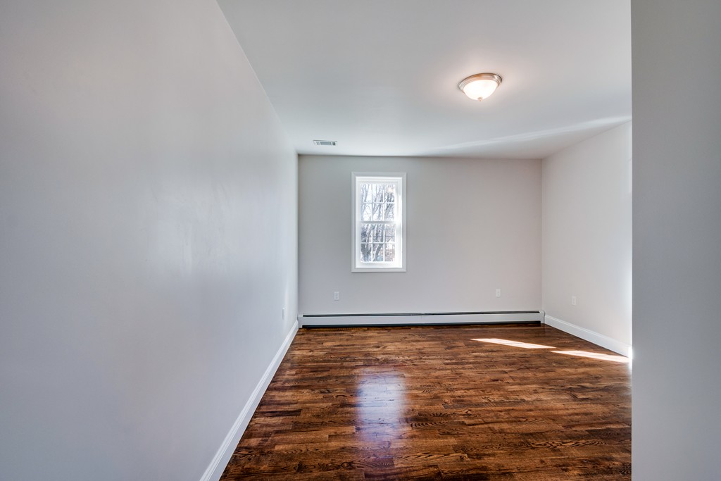 10 Felch Road Natick, MA 01760 - Photo 23 of 27 a view of empty room with wooden floor