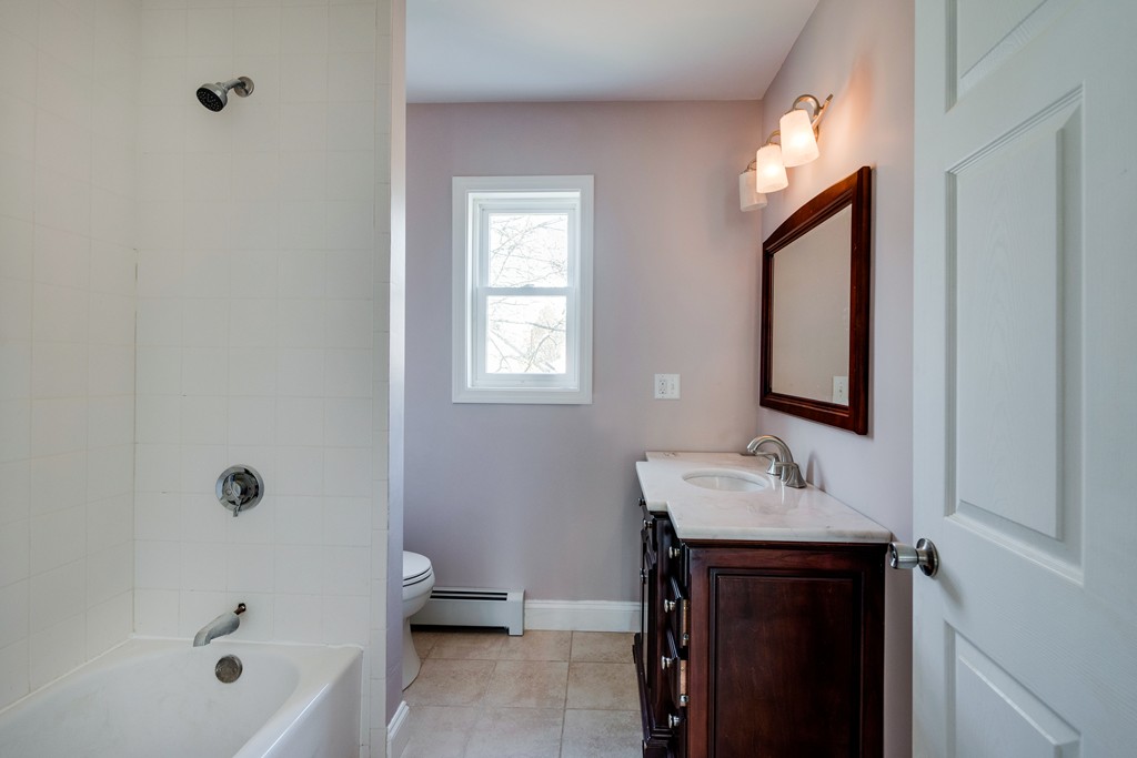 10 Felch Road Natick, MA 01760 - Photo 25 of 27 a bathroom with a sink a toilet and shower