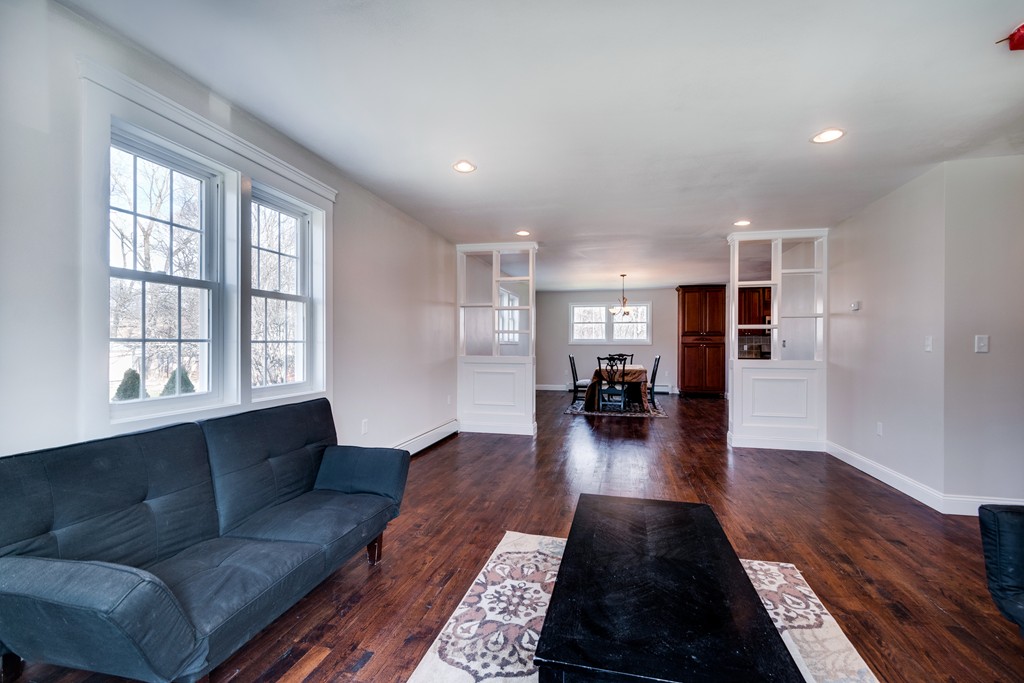 10 Felch Road Natick, MA 01760 - Photo 8 of 27 a living room with furniture and a wooden floor
