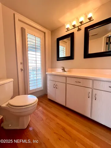a view of a house with pool and chairs