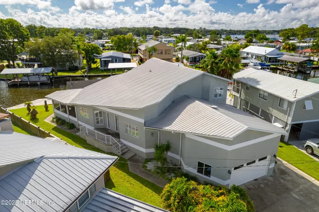 an aerial view of a house with outdoor space