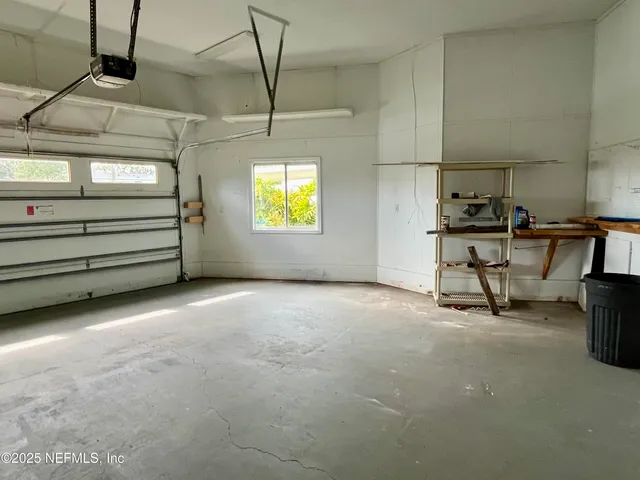 a view of an empty room with stairs