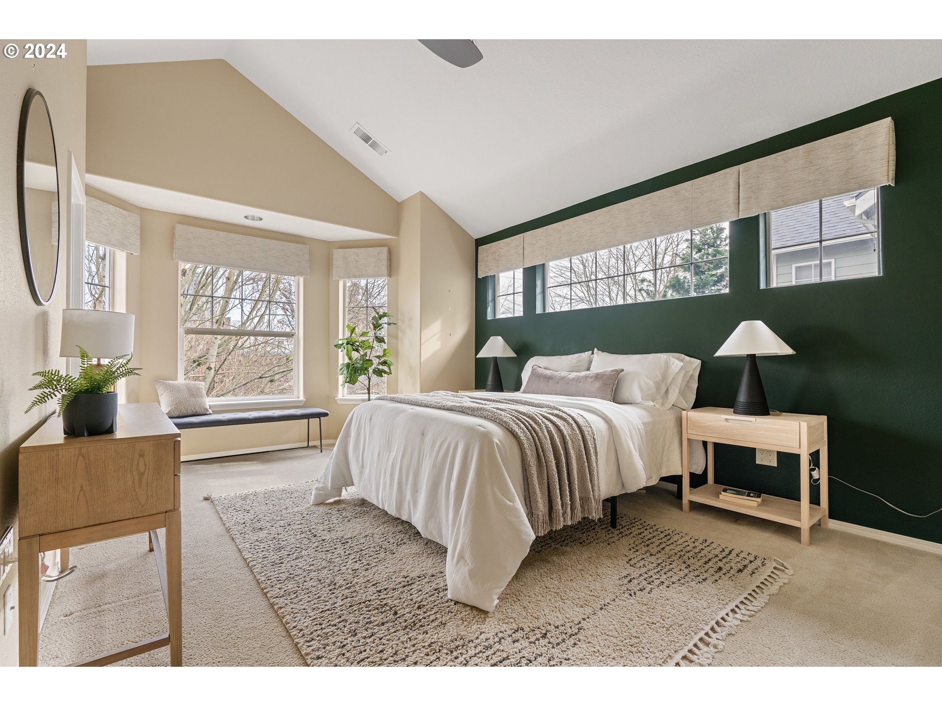 3531 South Kelly Avenue Portland, OR 97239 - Photo 11 of 21 a spacious bedroom with a bed a dresser next to a window