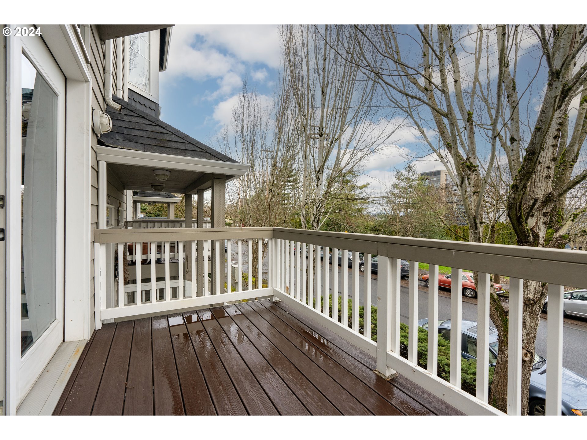 3531 South Kelly Avenue Portland, OR 97239 - Photo 18 of 21 a view of balcony with wooden floor and fence