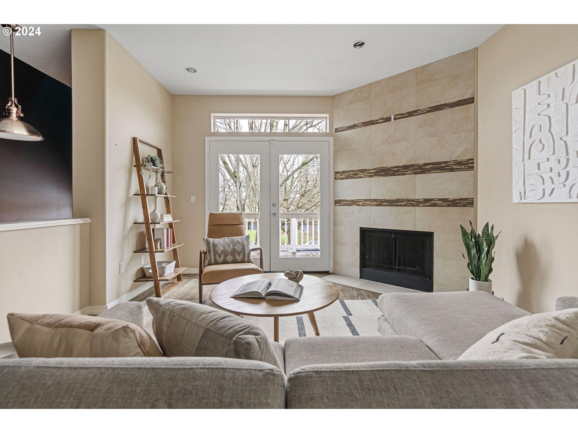 3531 South Kelly Avenue Portland, OR 97239 - Photo 2 of 21 a living room with furniture a window and a fireplace