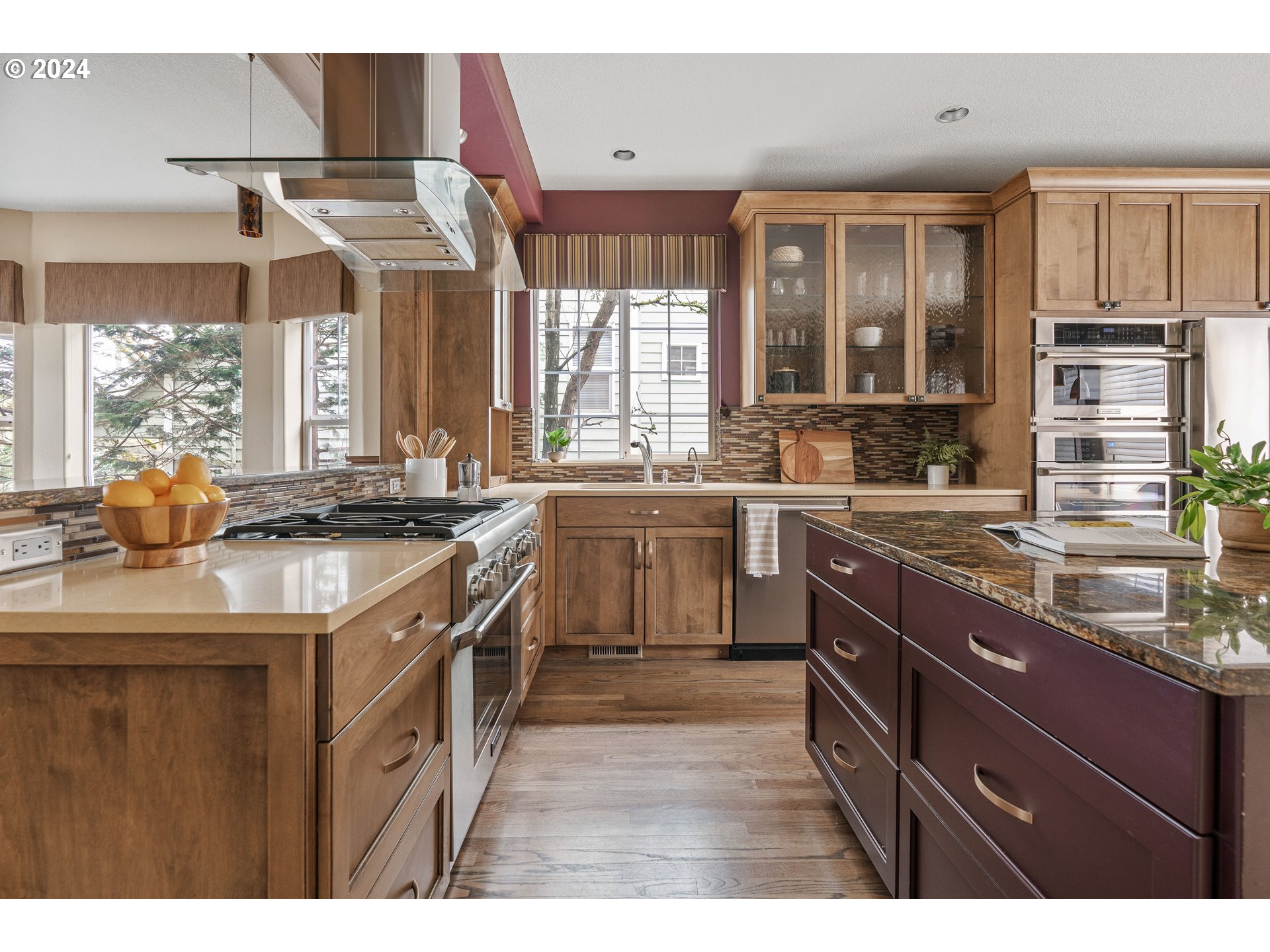 3531 South Kelly Avenue Portland, OR 97239 - Photo 6 of 21 a kitchen with stainless steel appliances granite countertop a sink a stove and a refrigerator