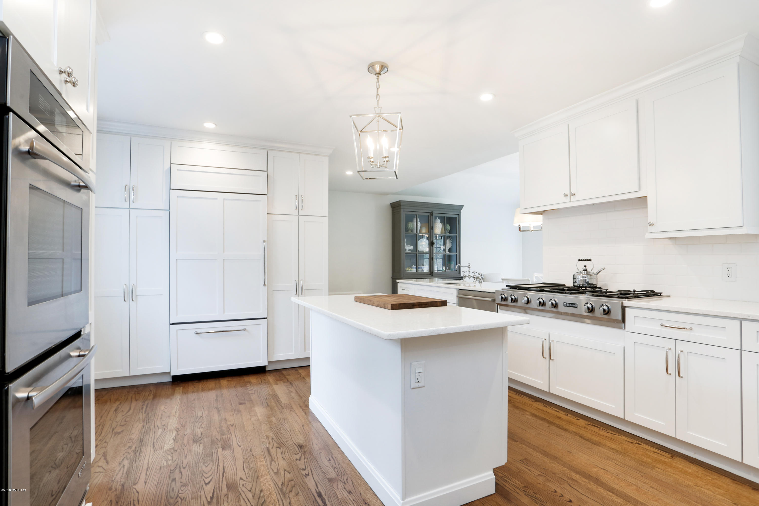 19 Dingletown Road Greenwich, CT 06830 - Photo 7 of 20 a kitchen with granite countertop white cabinets and white appliances