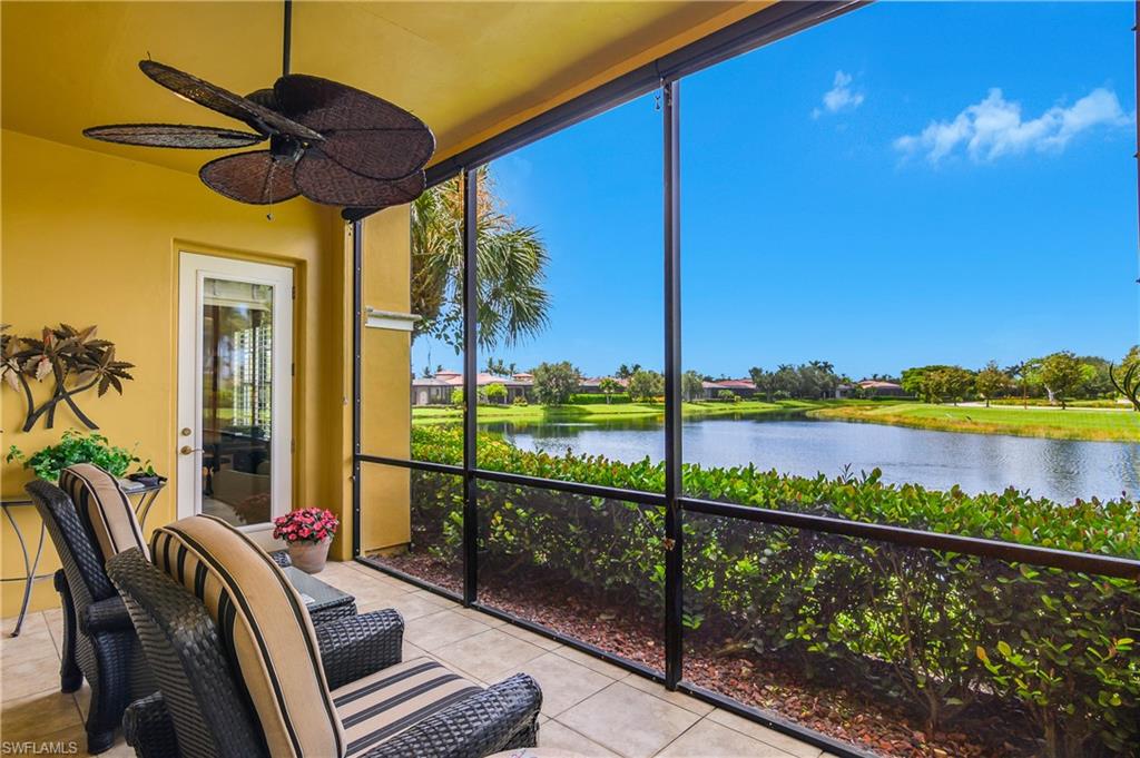 9109 Prima Way, Unit 102 Naples, FL 34113 - Photo 31 of 50 a view of balcony with wooden floor and outdoor seating