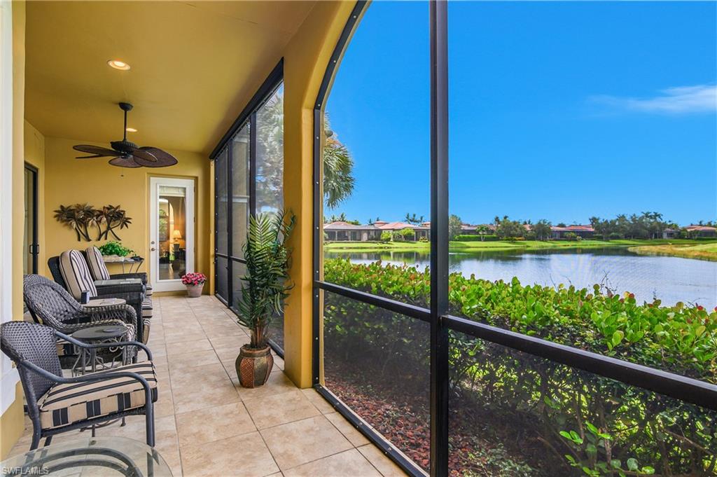 9109 Prima Way, Unit 102 Naples, FL 34113 - Photo 32 of 50 a view of a balcony with couches and wooden floor