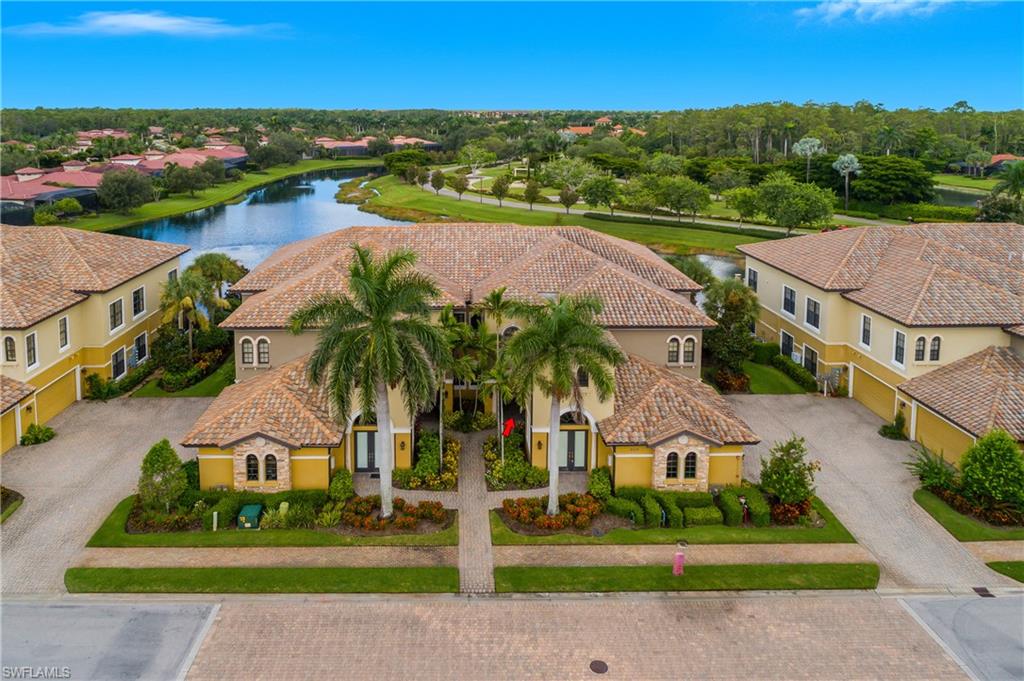 9109 Prima Way, Unit 102 Naples, FL 34113 - Photo 34 of 50 an aerial view of a house with a garden and lake view