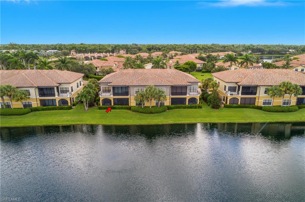 9109 Prima Way, Unit 102 Naples, FL 34113 - Photo 36 of 50 an aerial view of a house with a garden and lake view