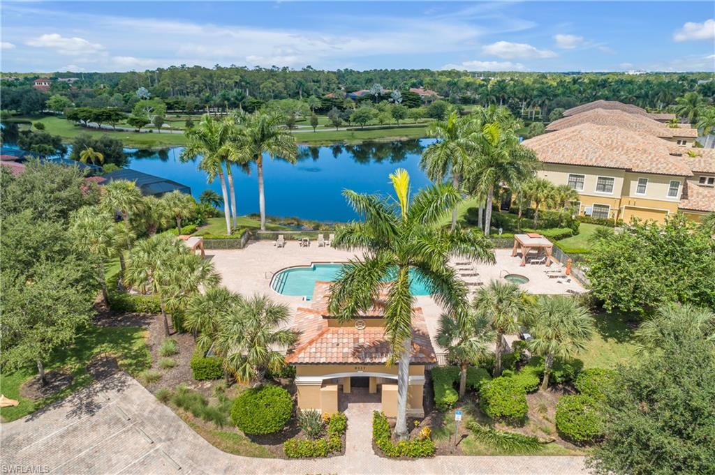 9109 Prima Way, Unit 102 Naples, FL 34113 - Photo 38 of 50 an aerial view of a house with a garden and lake view