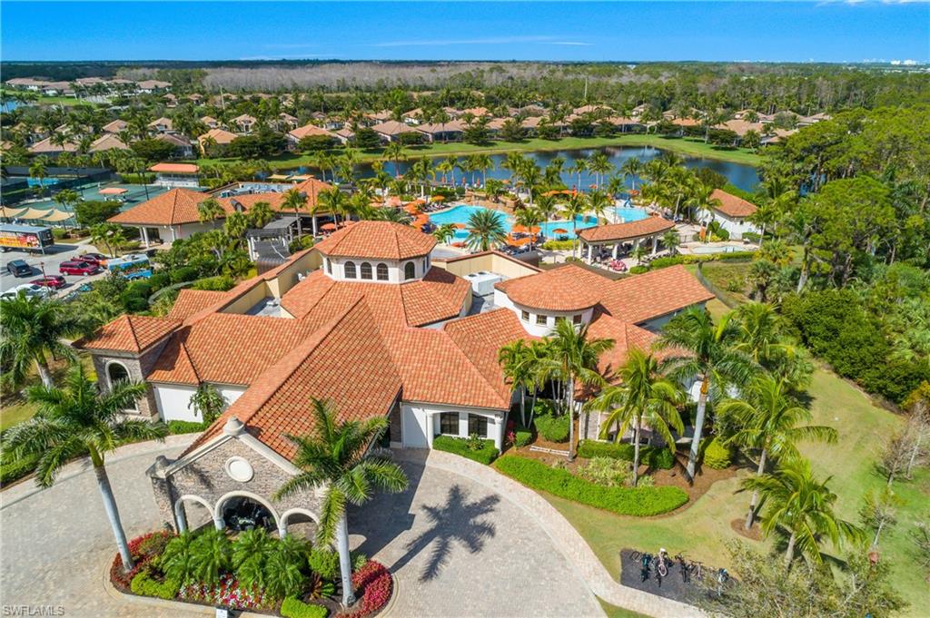 9109 Prima Way, Unit 102 Naples, FL 34113 - Photo 40 of 50 an aerial view of residential houses with outdoor space and trees