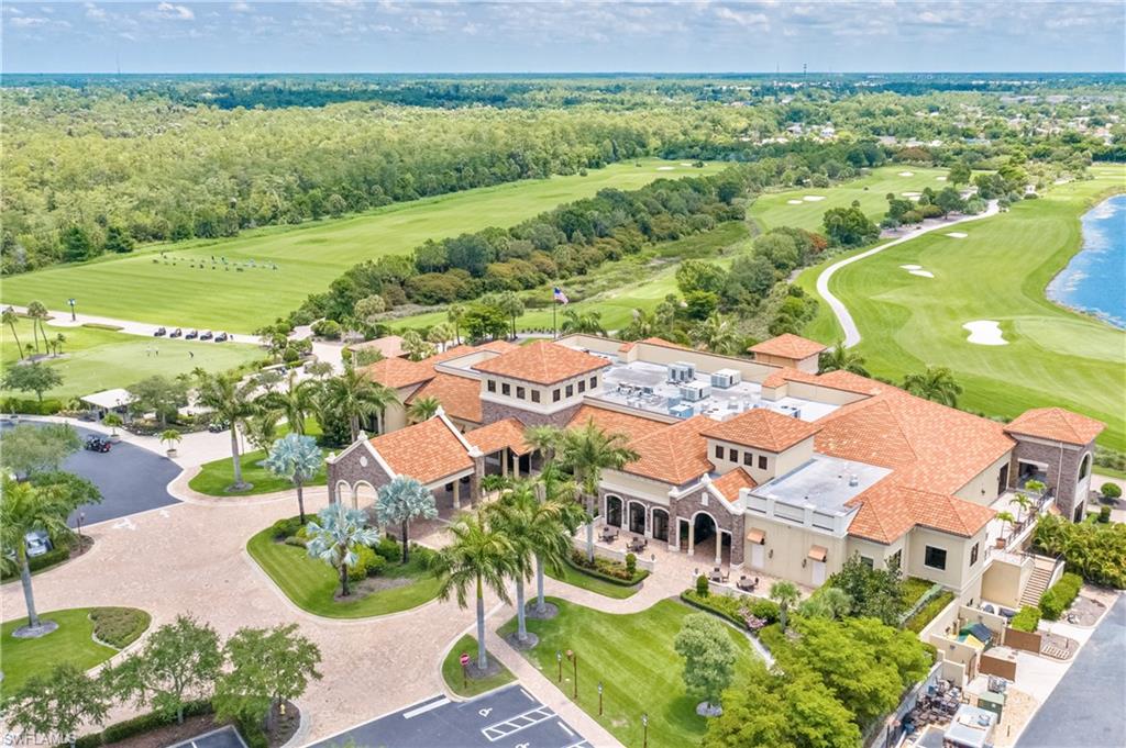 9109 Prima Way, Unit 102 Naples, FL 34113 - Photo 48 of 50 an aerial view of residential houses with outdoor space and street view