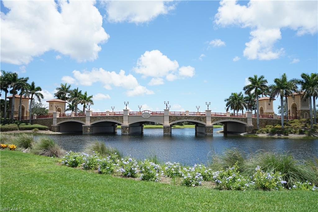 9109 Prima Way, Unit 102 Naples, FL 34113 - Photo 49 of 50 a view of a lake with cars parked