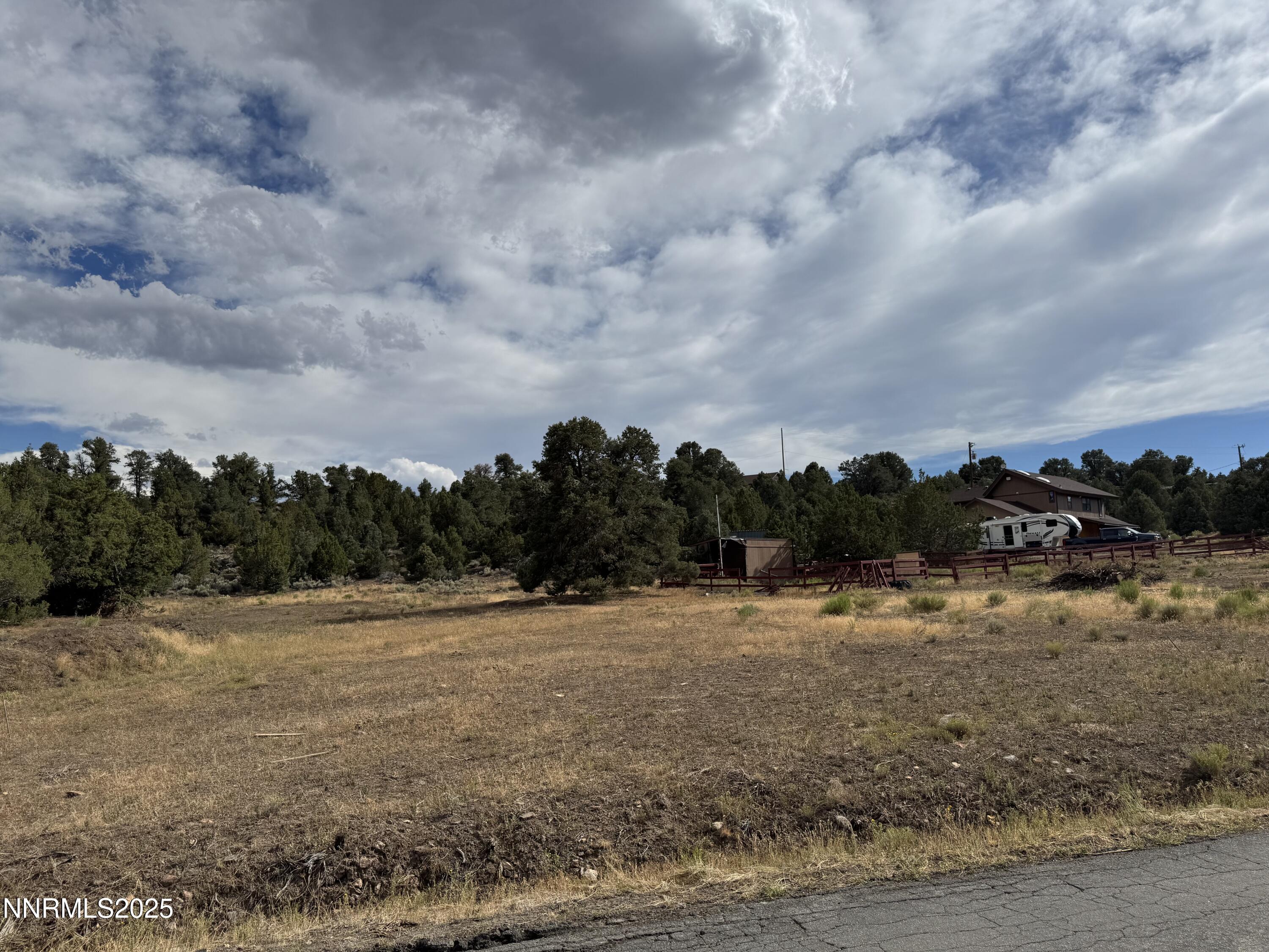 2523 Cartwright Road, Unit H16 Reno, NV 89521 - Photo 2 of 4 a view of a dry yard with trees