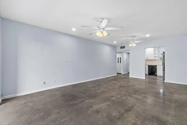 a view of an empty room with a window