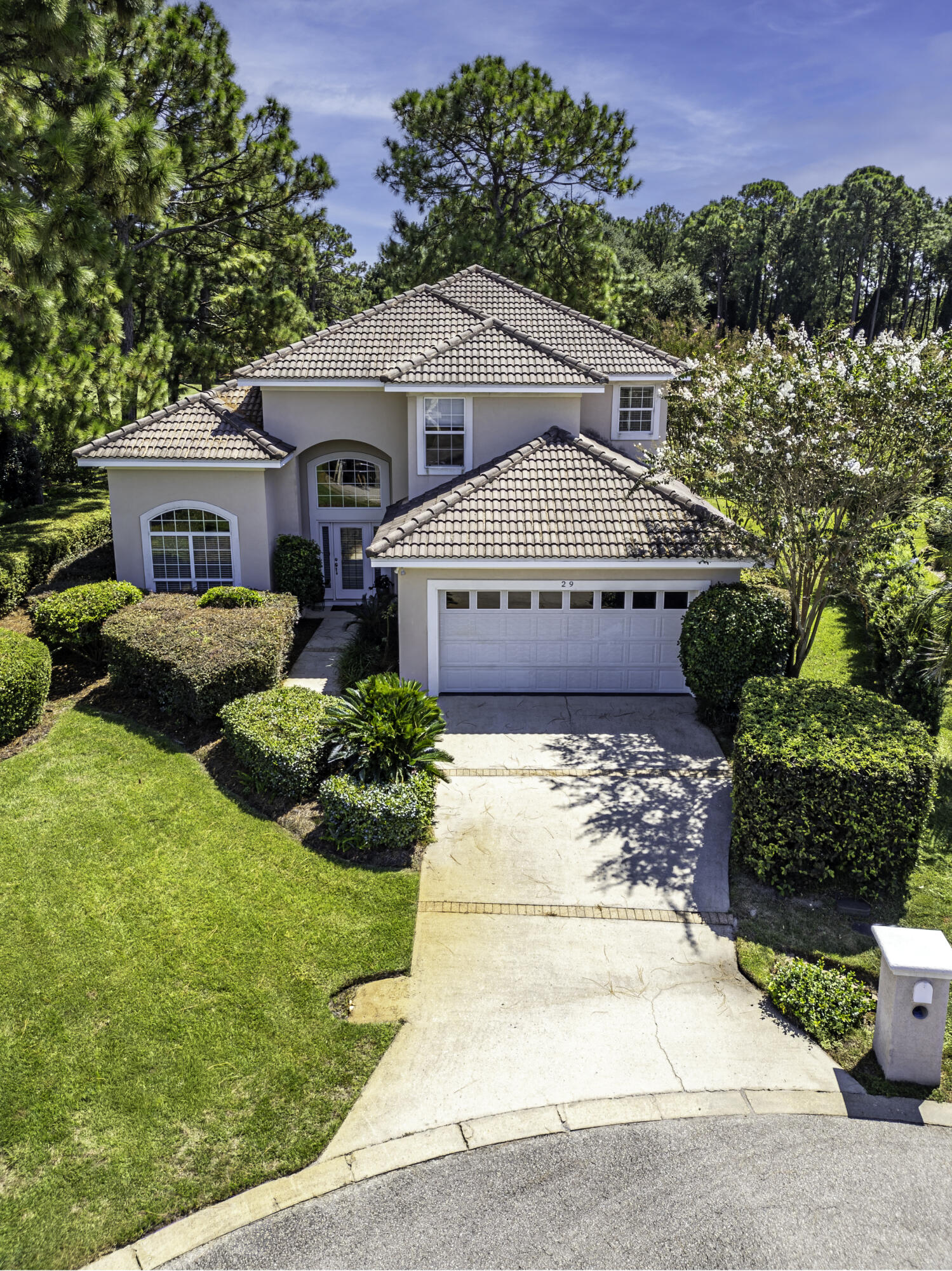 29 Ivory Court Miramar Beach, FL 32550 - Photo 2 of 39 a front view of a house with garden