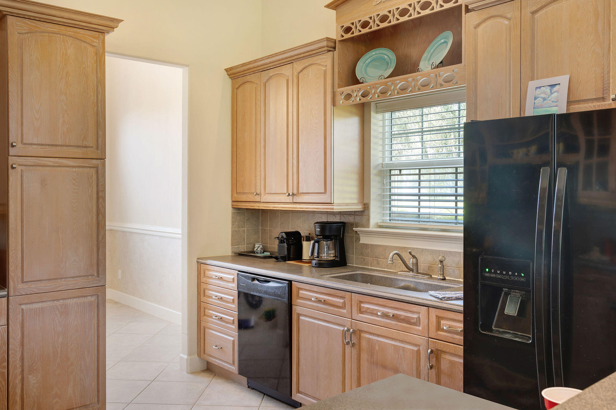 29 Ivory Court Miramar Beach, FL 32550 - Photo 36 of 39 a kitchen with stainless steel appliances granite countertop a refrigerator sink and cabinets