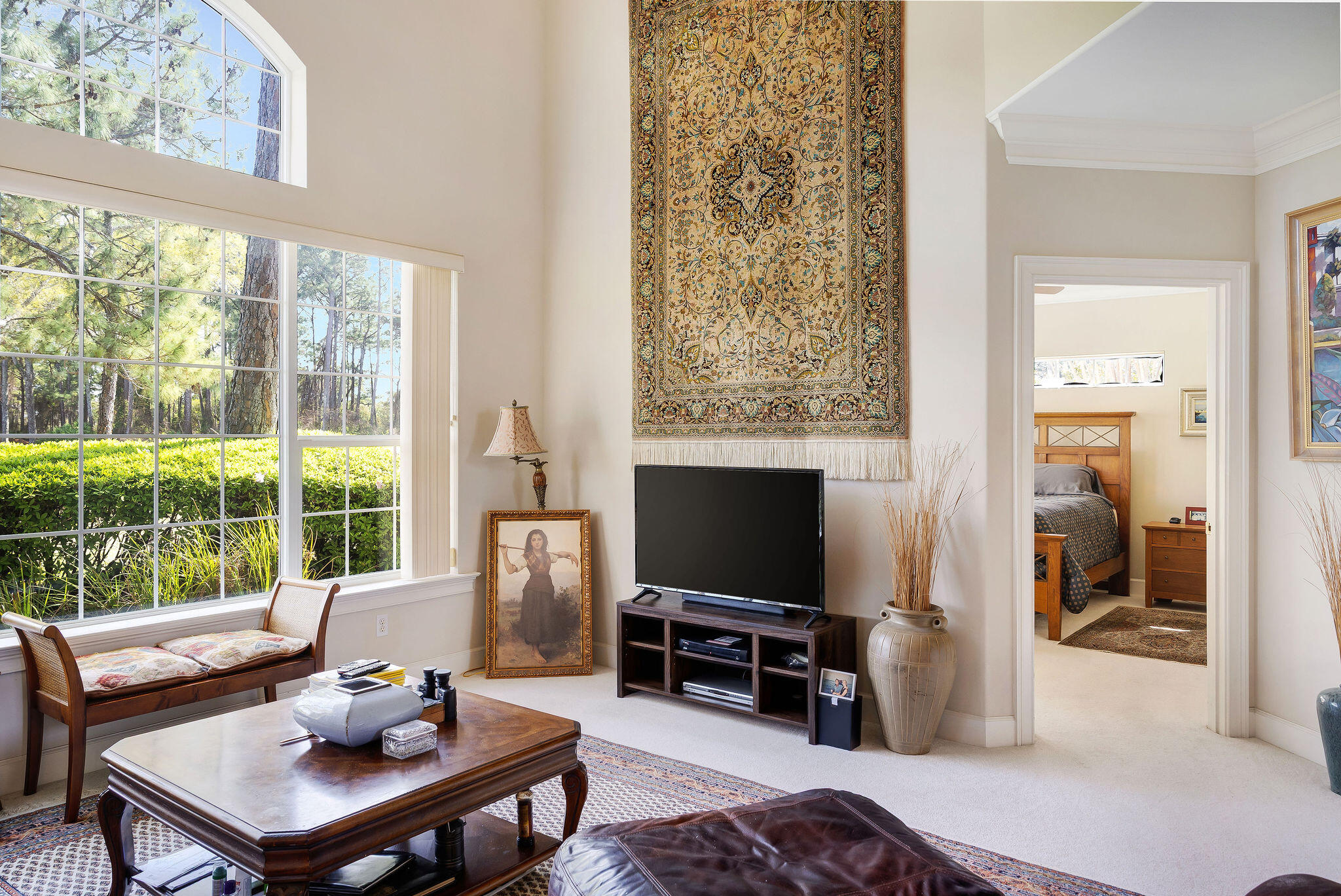29 Ivory Court Miramar Beach, FL 32550 - Photo 37 of 39 a living room with furniture a flat screen tv and a floor to ceiling window