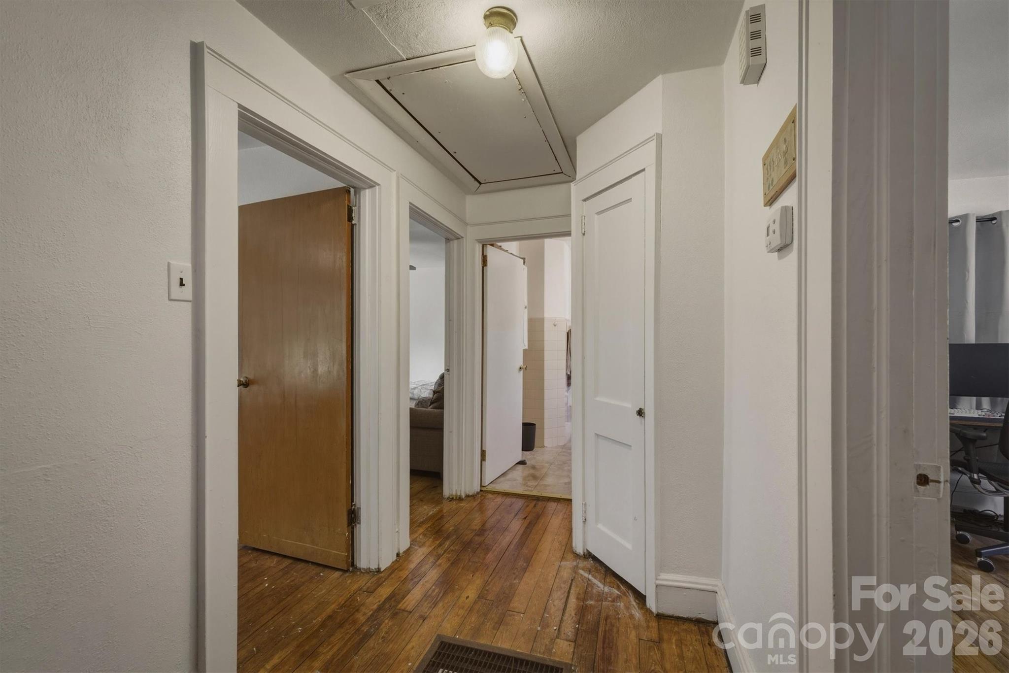 117 3rd Avenue Southwest Hickory, NC 28602 - Photo 14 of 21 a view of a hallway with wooden floor and staircase