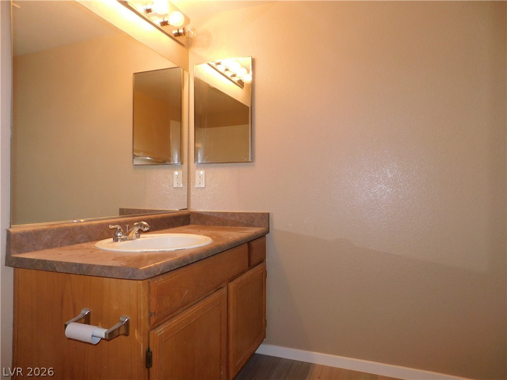 7255 West Sunset Road, Unit 2029 Las Vegas, NV 89113 - Photo 19 of 21 Functional vanity with dual mirrors and ample counter space provides convenience in this bathroom.