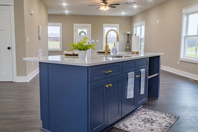 a spacious bedroom with a bed and a window