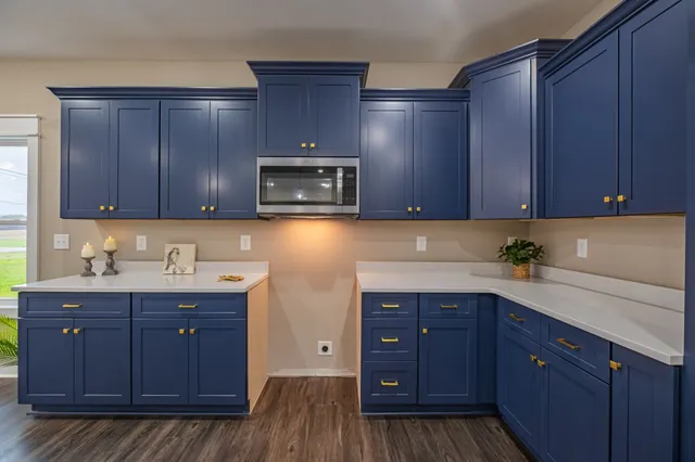 a bedroom with a large bed and a ceiling fan
