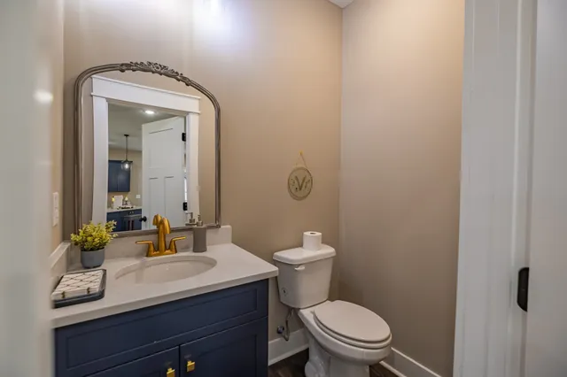 a view of a bathroom from a hallway