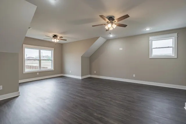 a view of a house with a yard and a garden