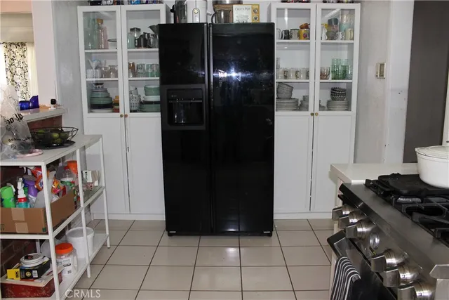 a living room with furniture a chandelier and a chandelier