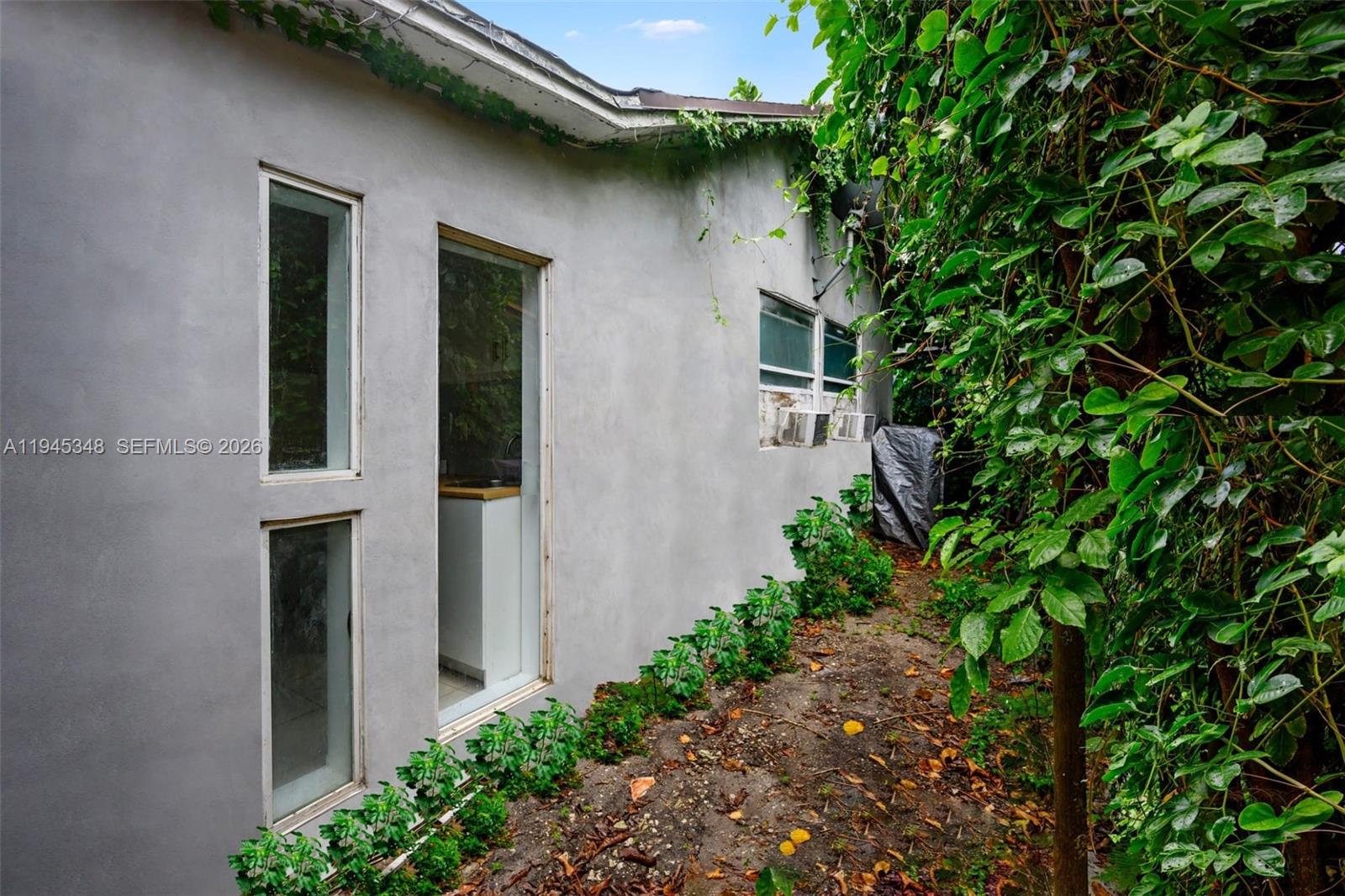 348 Northeast 58th Street Miami, FL 33137 - Photo 3 of 16 a house with a plant in front of it