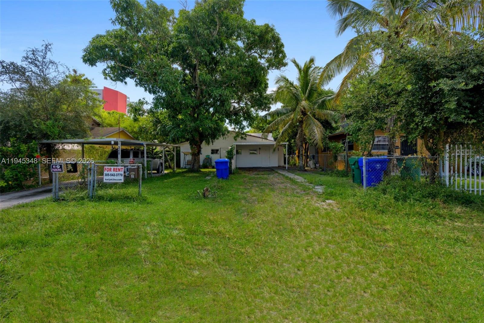 348 Northeast 58th Street Miami, FL 33137 - Photo 5 of 16 a view of a house with a backyard