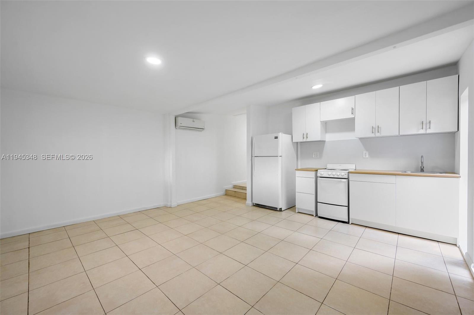 348 Northeast 58th Street Miami, FL 33137 - Photo 7 of 16 a room with a cabinets and appliances