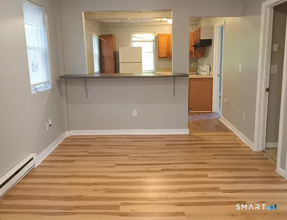 88 Olive Street Meriden, CT 06450 - Photo 2 of 7 a view of a room with wooden floor and staircase