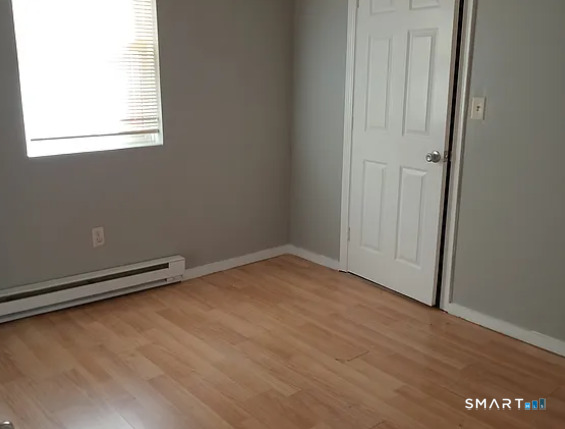 88 Olive Street Meriden, CT 06450 - Photo 6 of 7 an empty room with a window