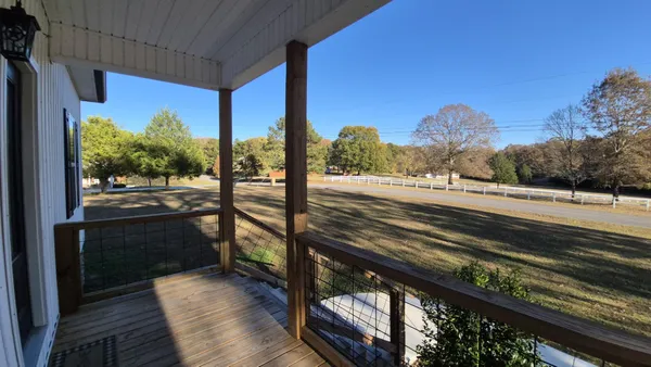 a view of a balcony with an outdoor space