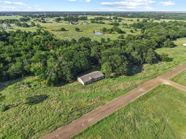 a view of a yard with an outdoor seating