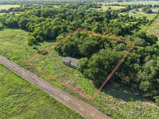 a view of a garden from a balcony