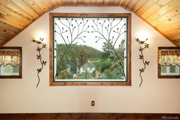 a view of a window and a tree