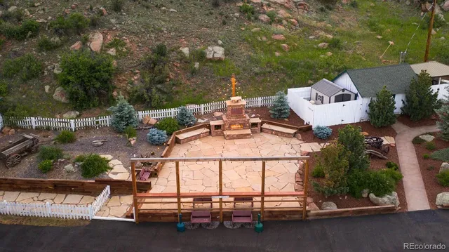 an aerial view of a house with outdoor space