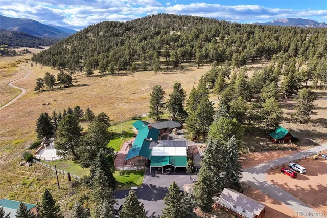 a view of a town with mountains and lake view