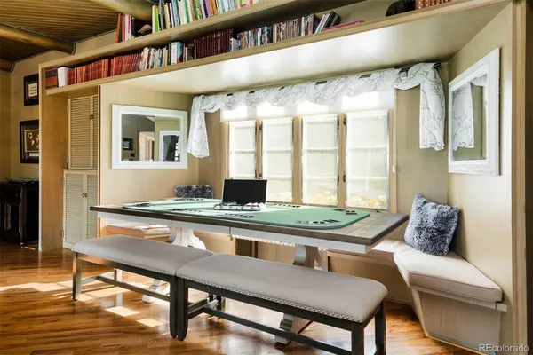 a dining room with furniture and window