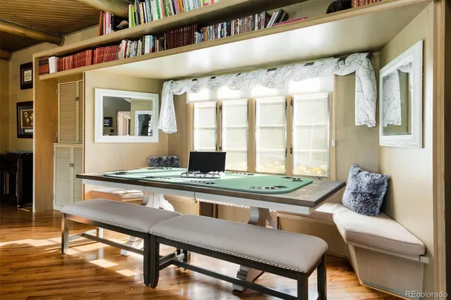 a dining room with furniture and window