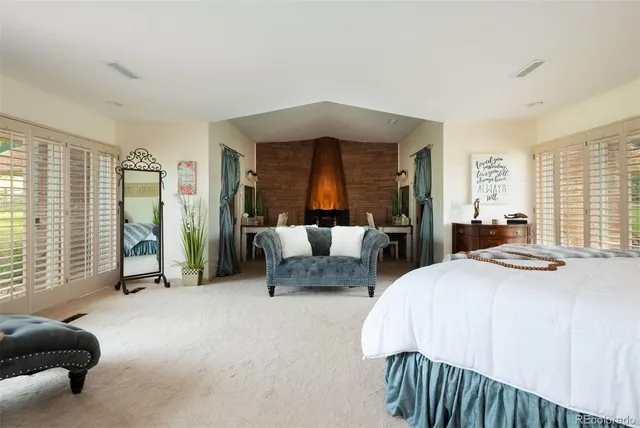 a bedroom with a bed and a couch